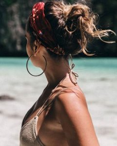 top knot with placate at beach